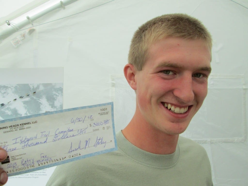 Travis handing in his $3000 entry fee for Iditarod 2013