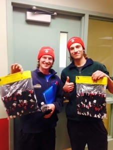 Travis Beals and Justin Steilstra With their Kipmik Dog Booties from the Knik 200