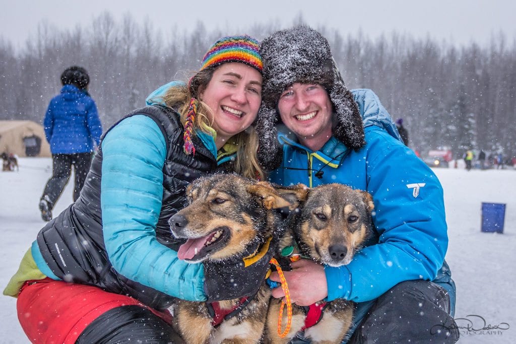 Sarah Stokey and Travis Beals at the start of Iditarod 2018 with Travis' Lead Dogs Granger and Krum.
