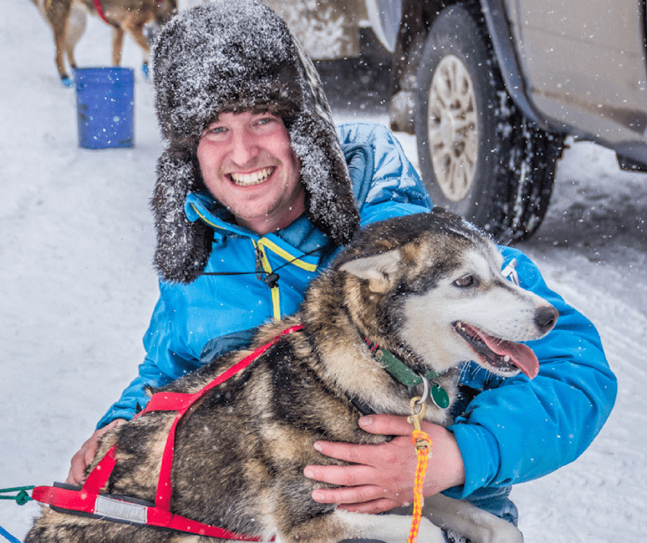 Travis and team dog Gremlin at the ceremonial start in Anchorage. Photo by Kalani Woodlock